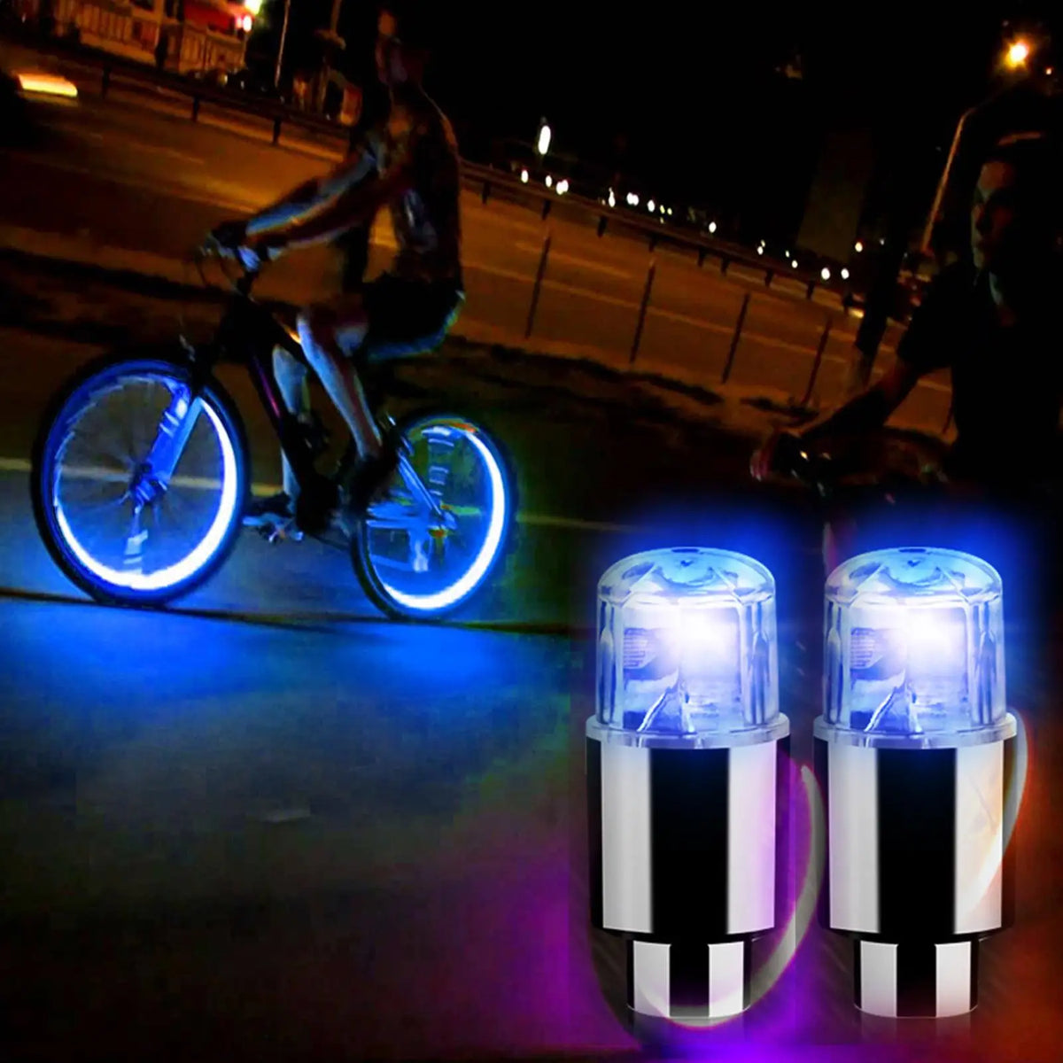 A pair of bright blue and purple LED tire valve stem lights are shown illuminating a dark surface.
