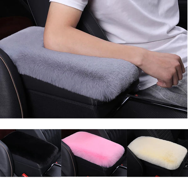 A set of plush car armrest cushions in gray, pink, and cream colors shown in a vehicle interior.