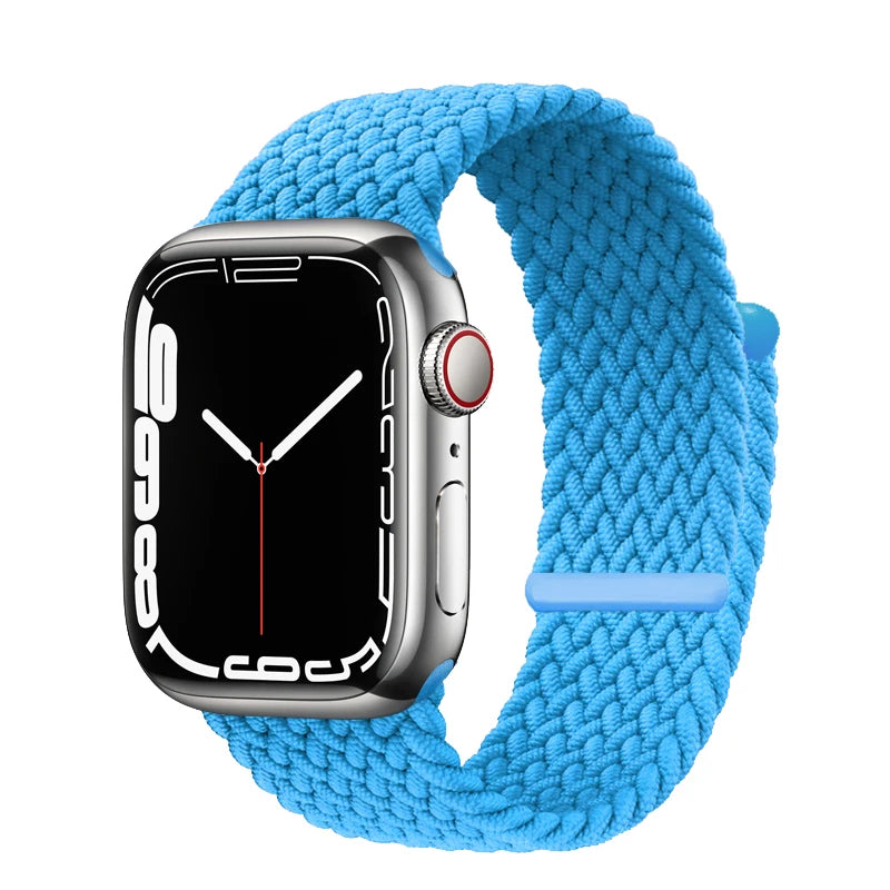 A silver Apple Watch is shown with a bright blue braided stretch band wrapped around it.