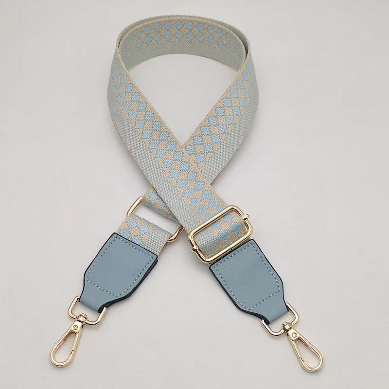 A light blue and beige braided nylon strap for a bag, featuring gold-toned metal hooks.