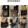 Display of the features of a chains and rivet nylon shoulder bag for women shown in various angles.