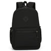 A black durable nylon commuter backpack shown from the back.
