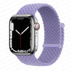 A silver Apple Watch is shown on a purple braided stretch band.