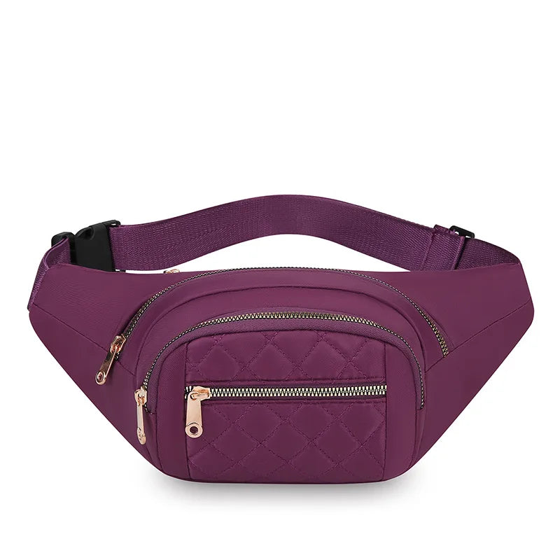 A purple quilted nylon crossbody belt bag with a gold zipper is shown from the side.