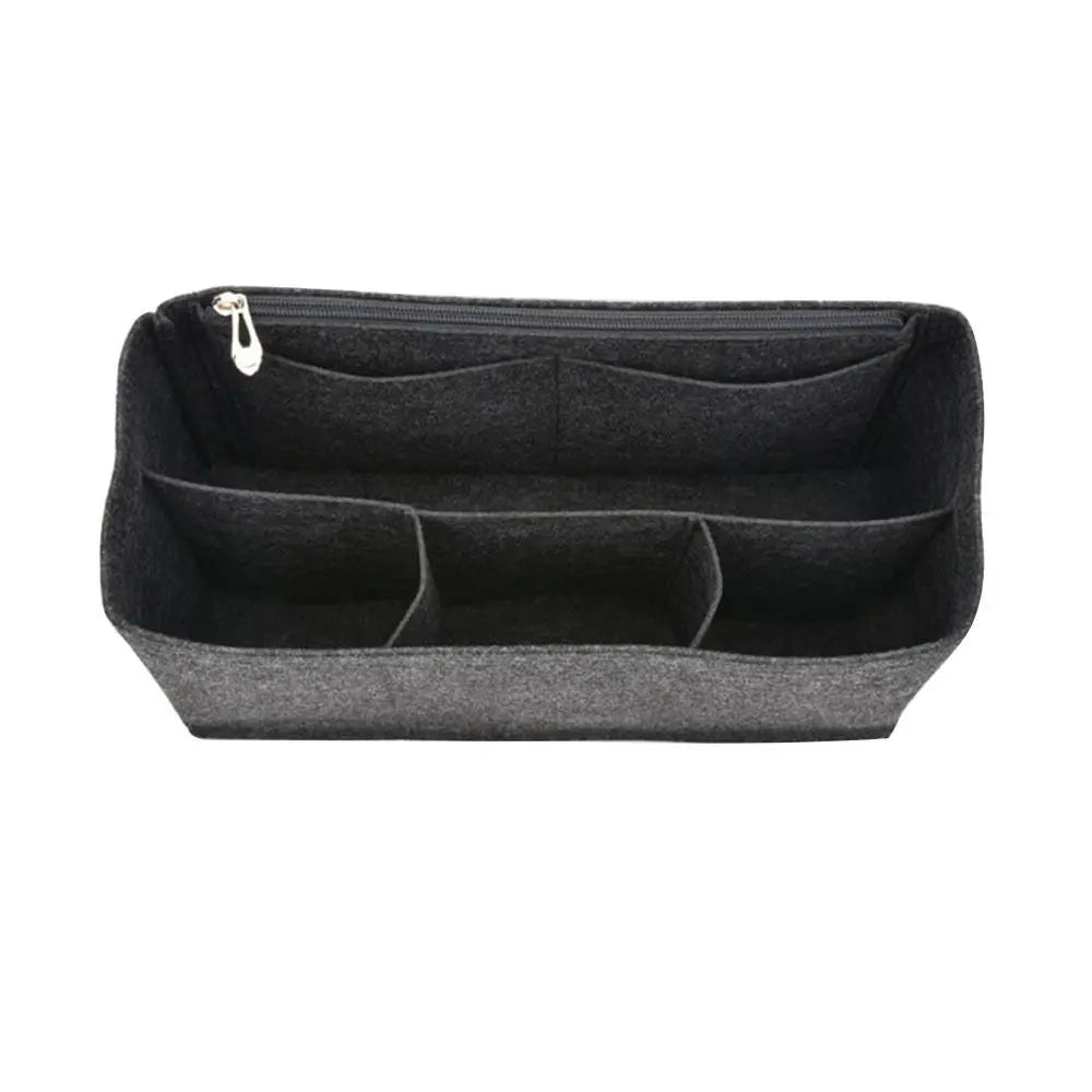 A dark gray felt insert liner designed for handbags, showing multiple compartments.