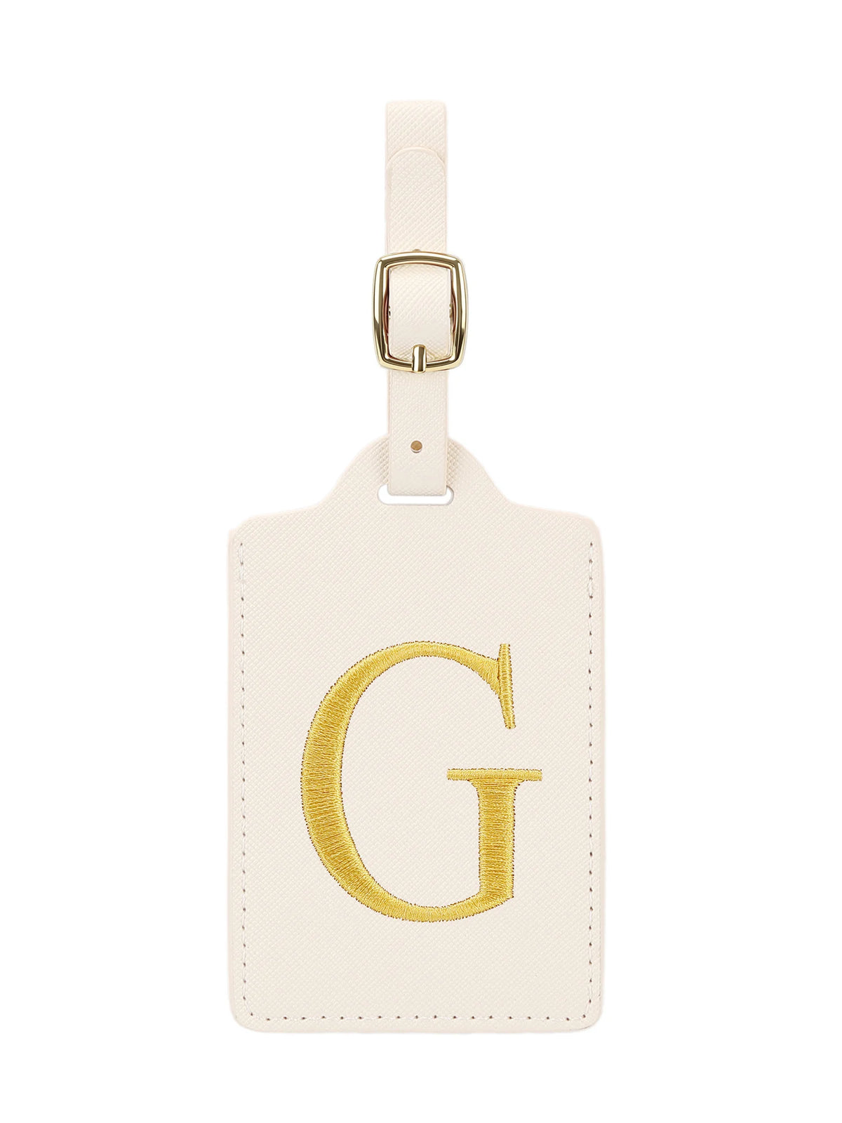 Étiquette de bagage beige en cuir rectangulaire avec un G brodé en or et une pince métallique argentée.