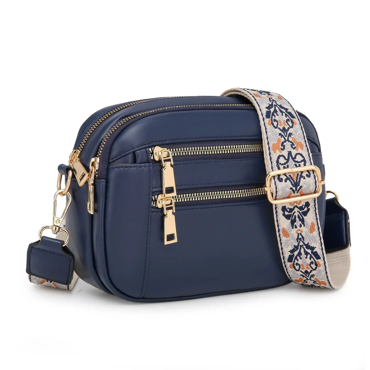 Navy blue PU leather crossbody bag with gold hardware and a patterned strap