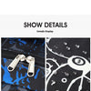 Close-up view of a black and blue waterproof fabric detail showing a bidirectional smooth pull tab on a backpack