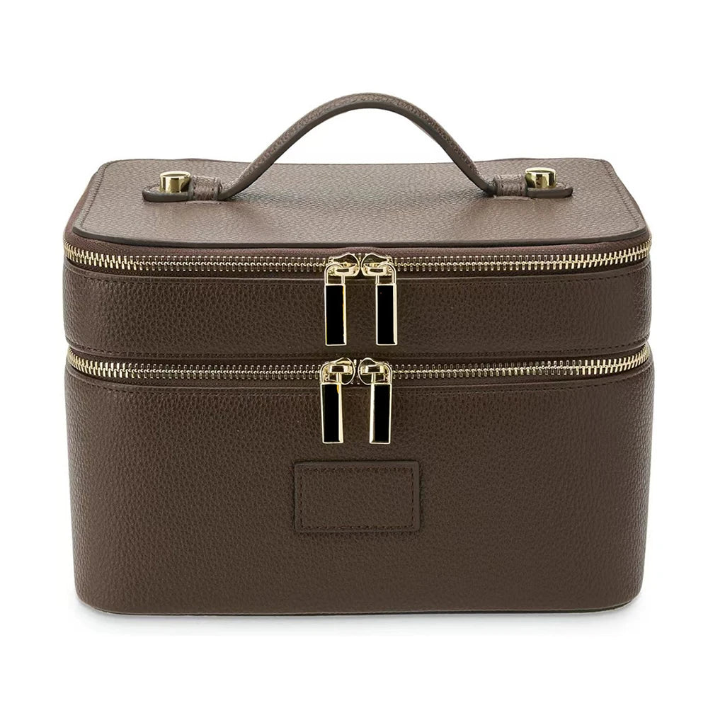 A brown double-layer makeup storage case with gold zippers and a leather handle.