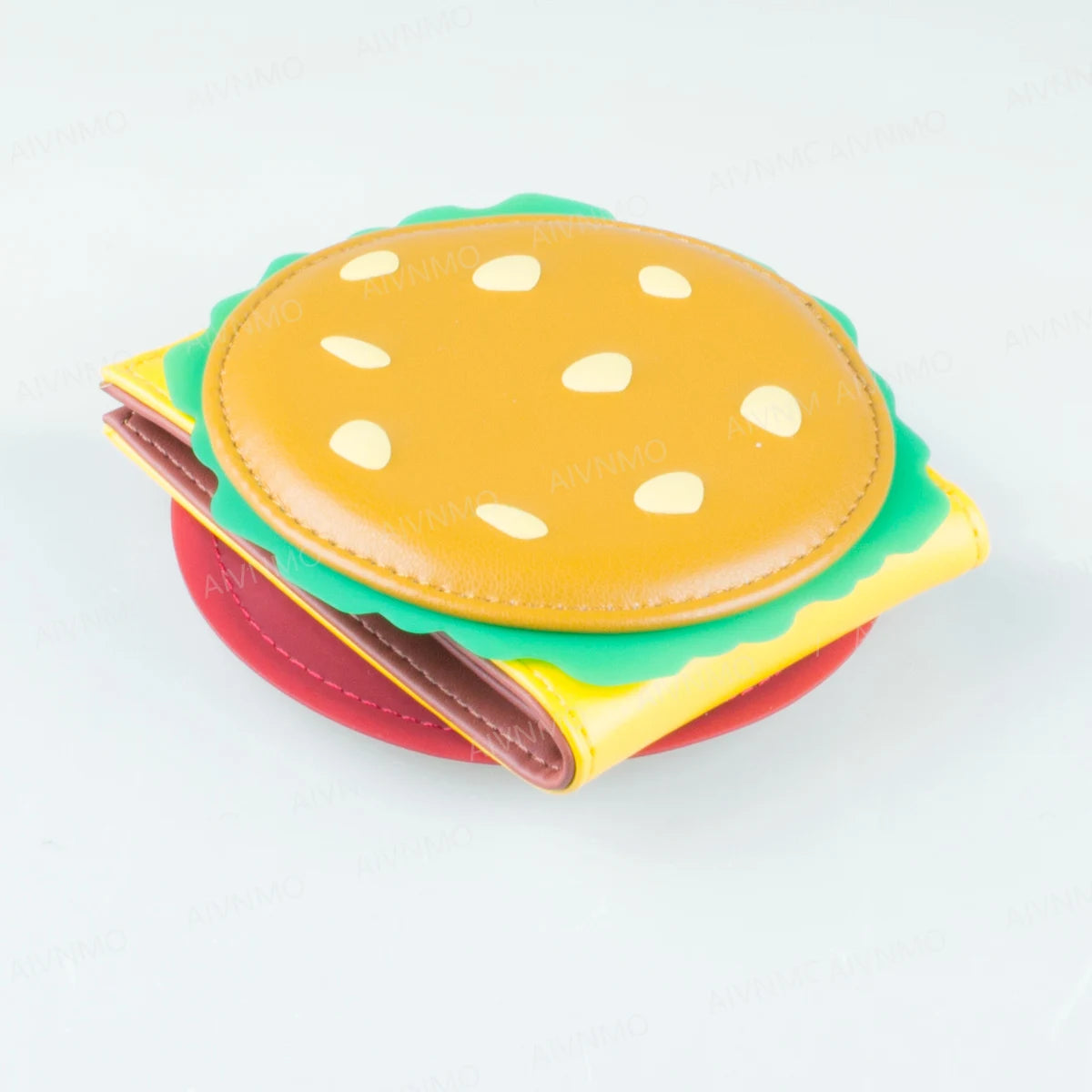 A colorful, layered foldable card holder wallet with a yellow sesame seed bun design.