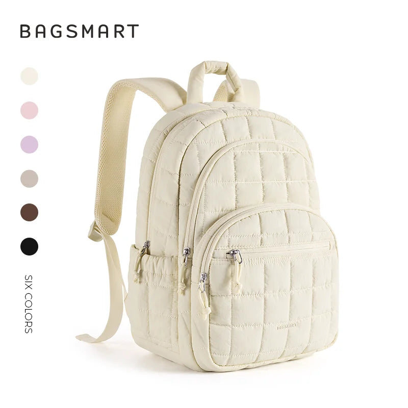 A cream-colored quilted casual backpack with tan straps and zipper details.