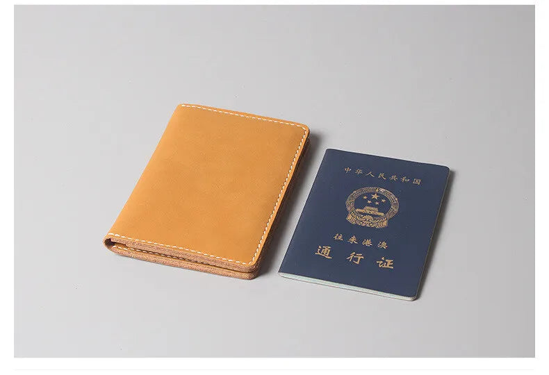 A brown leather passport and ticket holder with Chinese text and an emblem on a gray background.