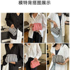 A display showing various styles of crochet handbags for women, including striped and solid designs.