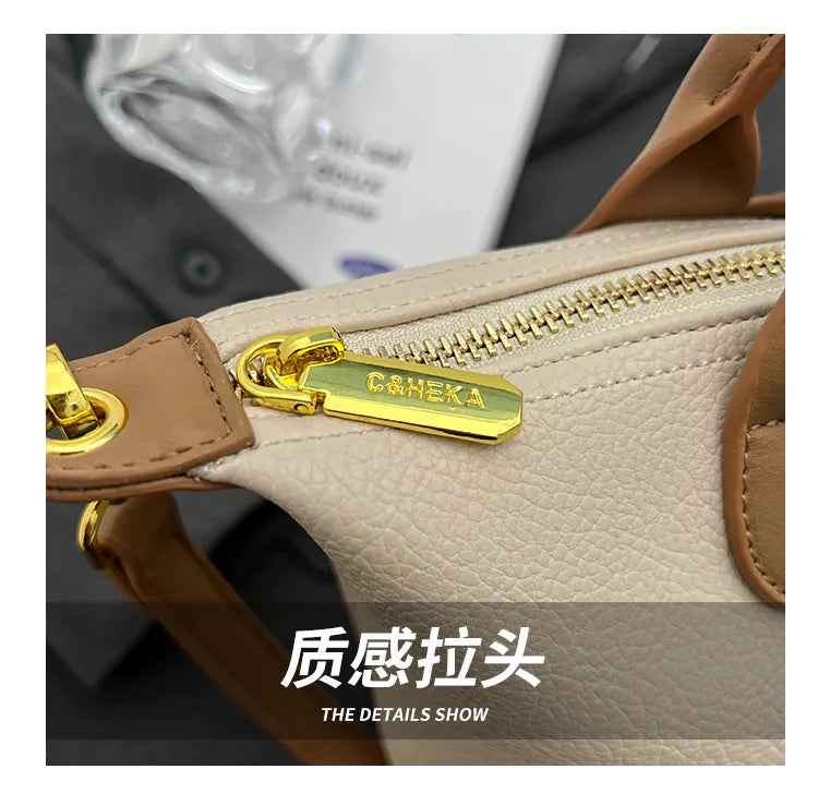 Close-up of a beige PU leather crossbody handbag featuring gold hardware and stitching details.