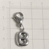 Silver stainless steel alphabet letter charm shaped like the number 8 with a lobster clasp