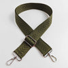 A wide, olive green adjustable handbag strap featuring an arrow jacquard pattern.