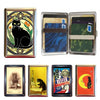A collection of vintage metal card holders and wallets featuring various designs including cats, nature scenes, and colorful 