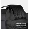 Close-up of a black expandable travel backpack showing shoulder strap reinforcement.