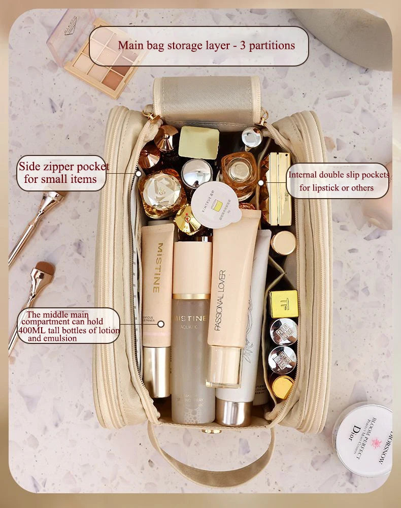 A beige PU leather travel makeup organizer with multiple compartments and double zippers for storing cosmetics.