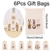 A set of six beige drawstring gift bags featuring embroidered Easter bunny designs.