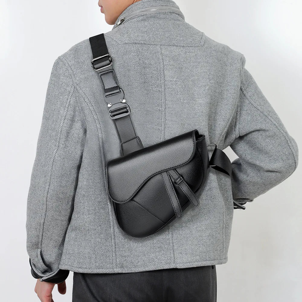 A gray jacket features a black chest bag with a strap worn across the body.