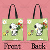 A pair of light green cartoon tote bags featuring a white dog character, Snoopy, with flowers.