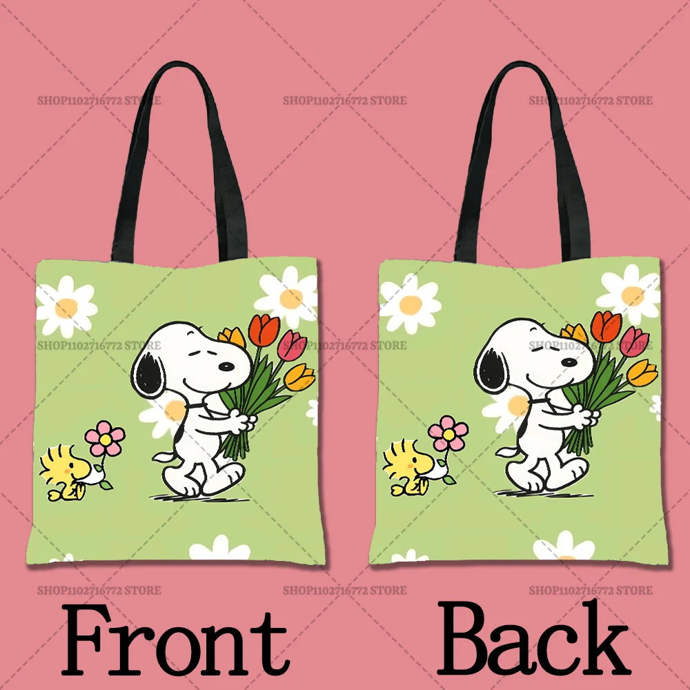A pair of light green cartoon tote bags featuring a white dog character, Snoopy, with flowers.