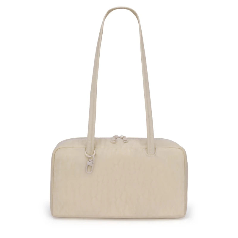 A beige leopard print nylon shoulder tote bag shown from the front.