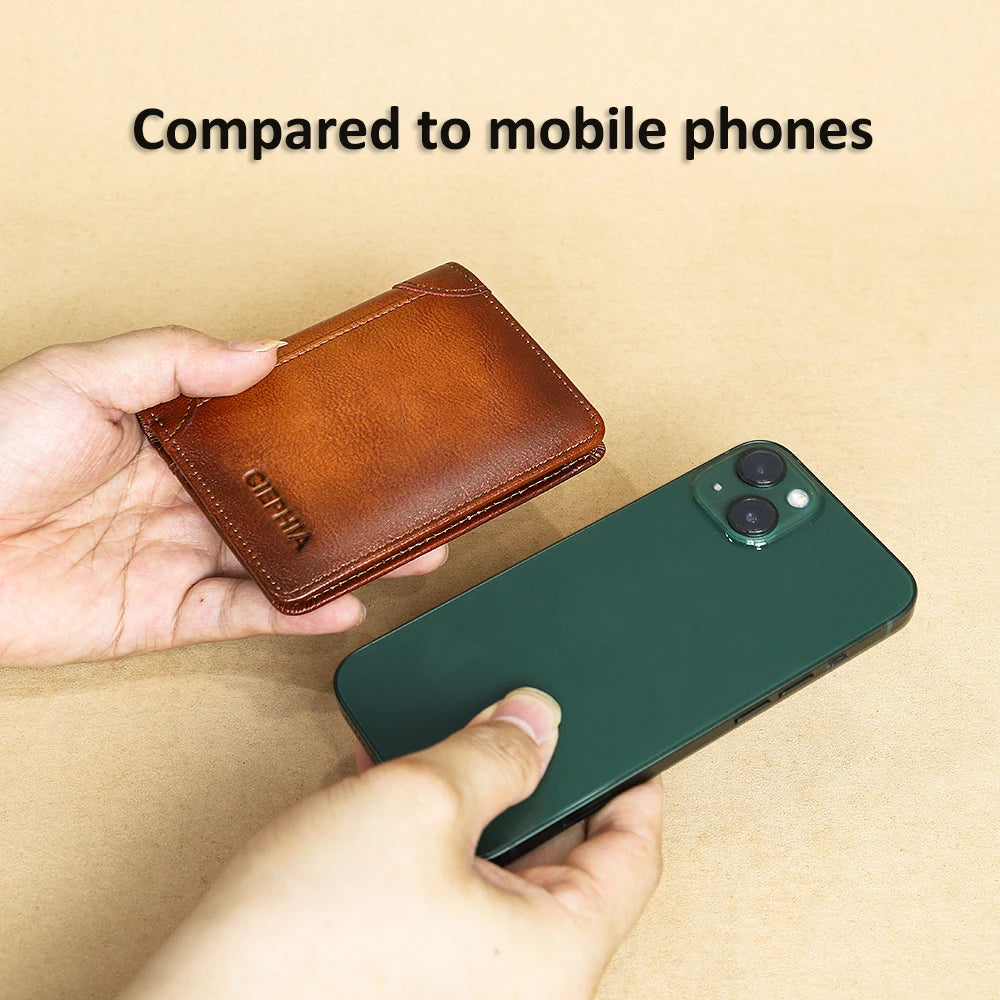 A brown genuine leather bifold wallet is shown next to a dark green smartphone, compared to mobile phones.