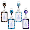 A set of retractable badge reels featuring ID cards with neck straps and colorful floral patterns.