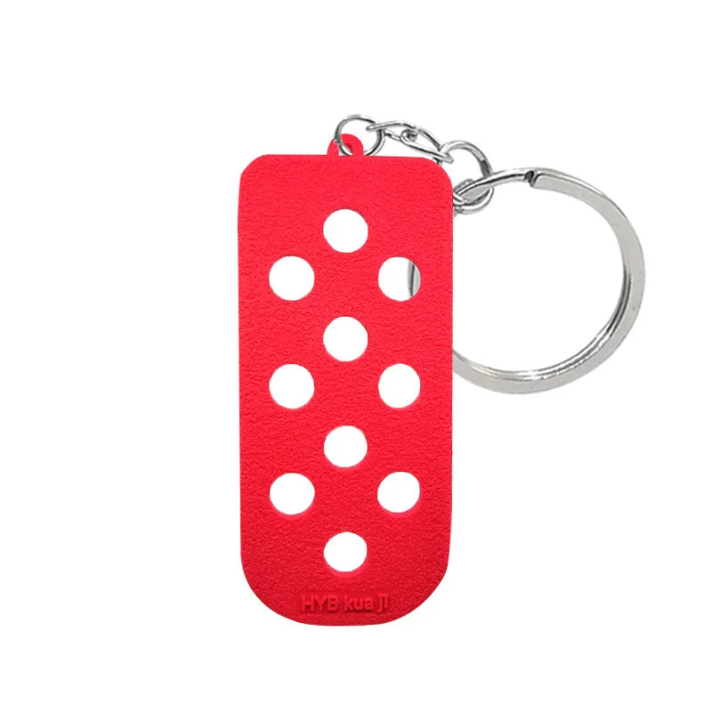 Porte-clés avec porte-clés en silicone rouge et anneau argenté.