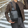 A man wearing a brown leather jacket and gray pants is holding a black geometric pattern crossbody bag.