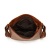 Sac à main en cuir PU marron avec rabat et sangle, ouvert pour montrer l'intérieur.