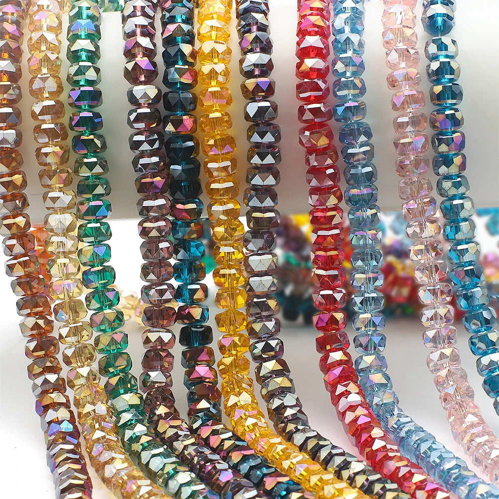 A collection of faceted crystal glass beads in various colors and shapes for jewelry making