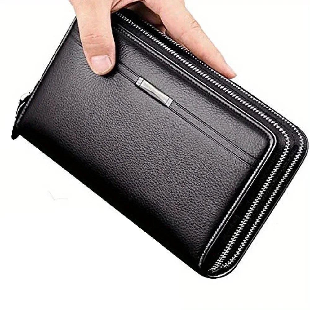 A hand is opening a black leather long zipper wallet clutch for business and daily use.