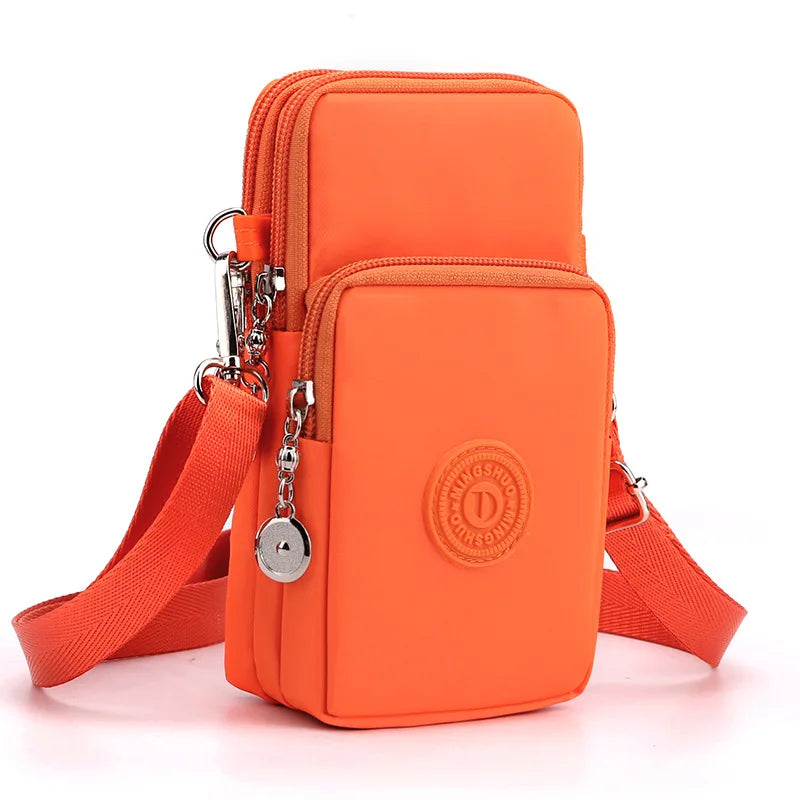 Orange compact nylon crossbody phone bag with adjustable strap