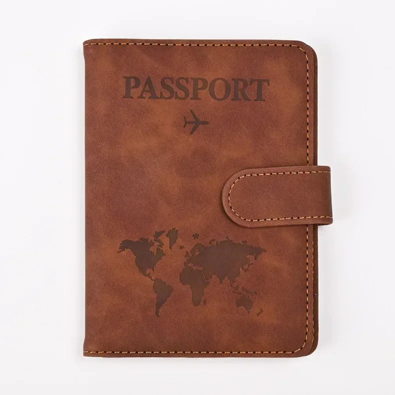 A brown genuine PU leather passport and ticket wallet cover with embossed text and a world map design.