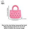 Pink round PVC handbag with a perforated design and a loop handle