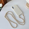 A white smartphone is shown with an adjustable metal shoulder strap lying on a white surface.