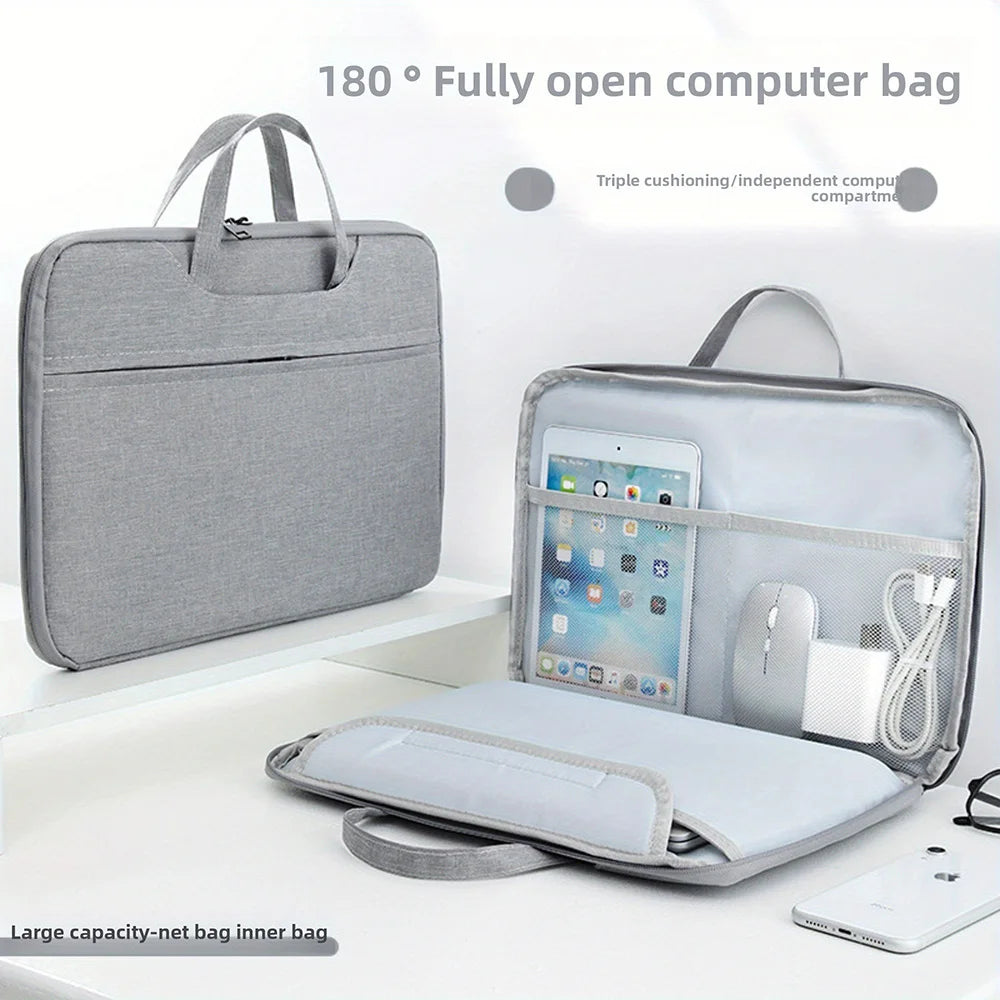 A gray fully open computer bag or laptop sleeve displaying internal cushioning and compartments.