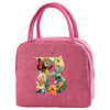 A pink insulated canvas lunch bag featuring a floral butterfly design.