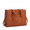 A brown leather laptop tote bag with crocodile texture and leather handles.