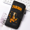 Black zippered clutch bag featuring an orange tiger graphic and gold accents, resting on a white surface.