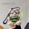 A fluffy bear plush toy is shown holding a camera and glasses, likely used as a keychain.