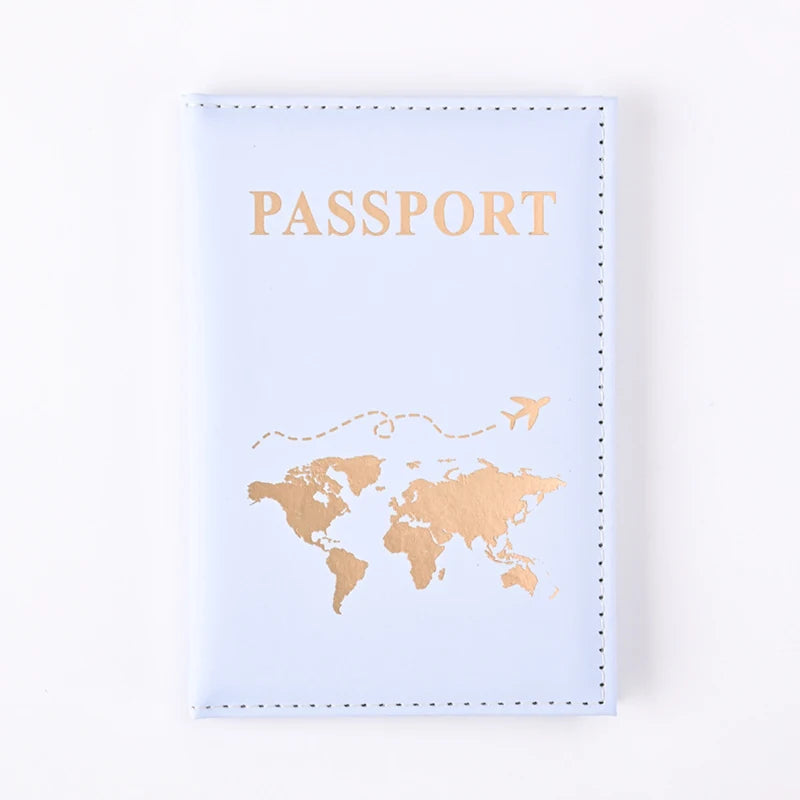 A light blue passport holder wallet with gold foil printing of a world map and the word PASSPORT.