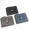 A set of three compact leather card holder wallets in black and gray tones displayed on a white background.