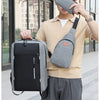 A young man wearing a beige shirt and gray pants holds a gray backpack and a gray wallet.