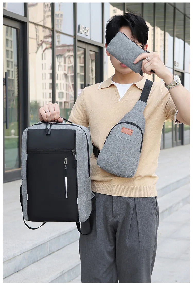 A young man wearing a beige shirt and gray pants holds a gray backpack and a gray wallet.
