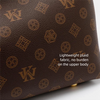 A dark brown leather crossbody tote bag with a subtle gold geometric print.