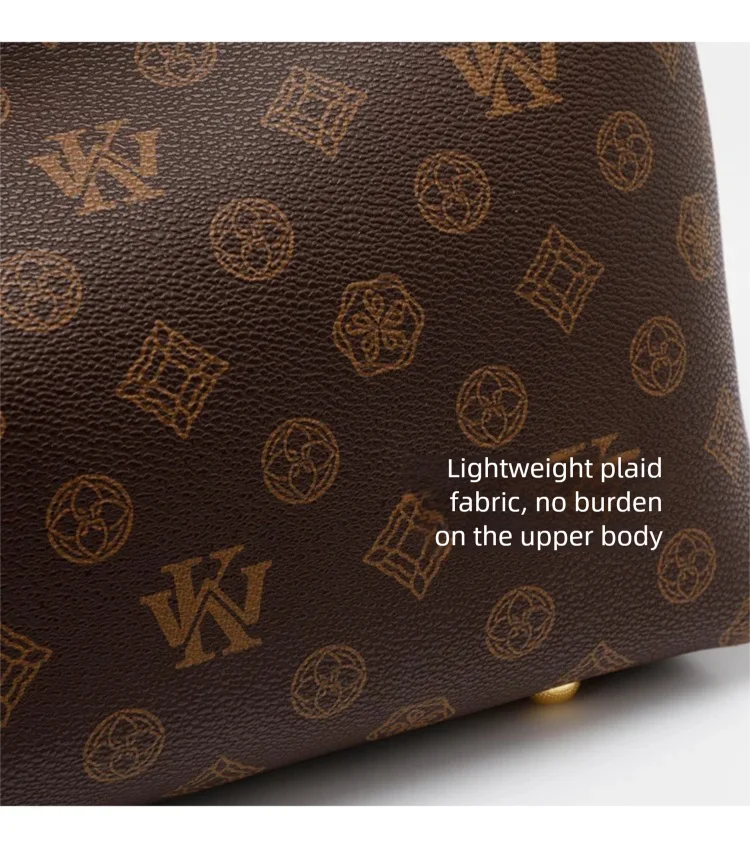 A dark brown leather crossbody tote bag with a subtle gold geometric print.